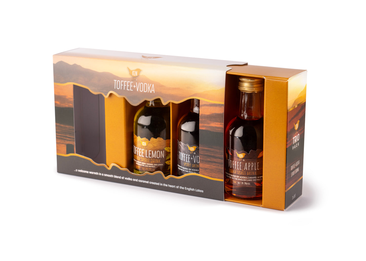 Front view of Trio Gift pack in full colour printed box with a lake district view in background. Slide out tray holding three 5cl bottles of original Kin Toffee Vodka, Kin Toffee Apple Vodka, and Kin Toffee Lemon Vodka
